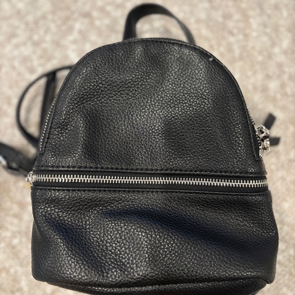 Steve Madden Black Faux Leather mini Backpack. 8” x 10”